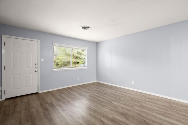 2021 Wheless Ln, Austin, TX 78723 - unfurnished room with wood finished floors and baseboards
