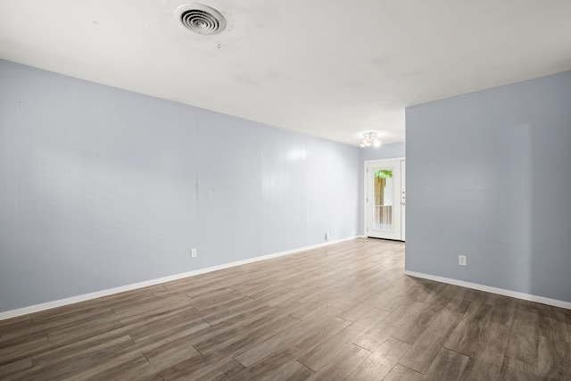 2021 Wheless Ln, Austin, TX 78723 - empty room with wood finished floors and baseboards