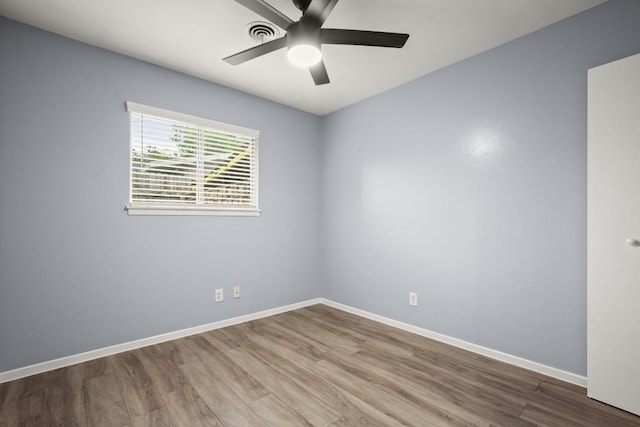 2021 Wheless Ln, Austin, TX 78723 - spare room featuring wood finished floors and a ceiling fan