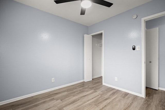 2021 Wheless Ln, Austin, TX 78723 - unfurnished bedroom with wood finished floors, a closet, and a ceiling fan