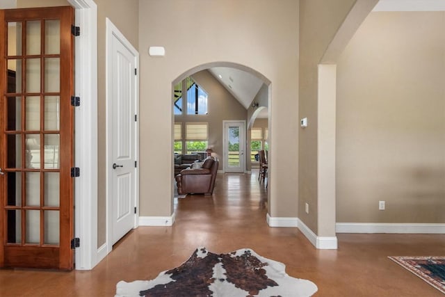 9769 Fm 1361, Snook, TX 77879 - foyer featuring arched walkways, concrete flooring, and high vaulted ceiling