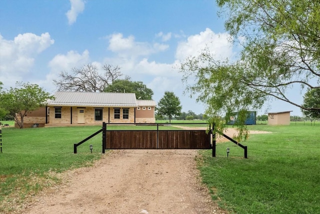 9769 Fm 1361, Snook, TX 77879 - view of front of property with a metal roof, a front lawn, and brick siding