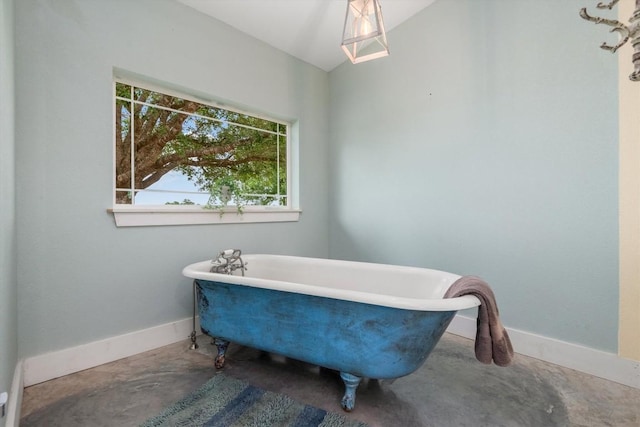9769 Fm 1361, Snook, TX 77879 - full bath with concrete flooring, a freestanding bath, and vaulted ceiling
