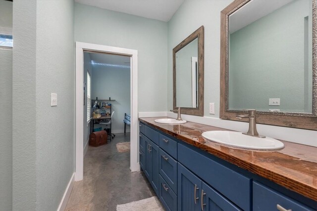 9769 Fm 1361, Snook, TX 77879 - bathroom featuring double vanity and concrete floors