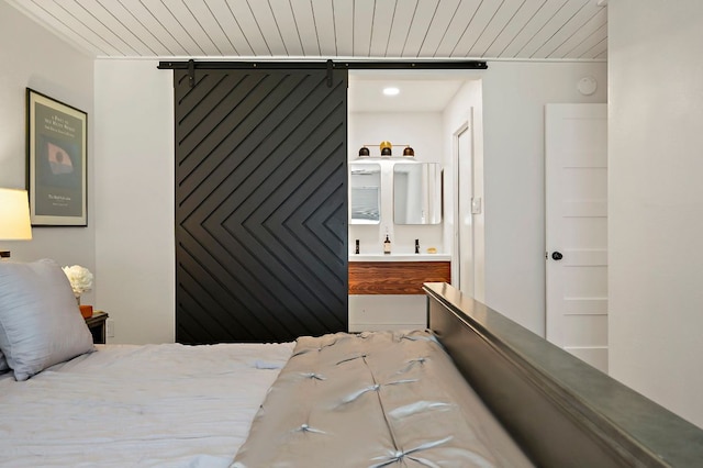 6101 Bridlington Cir, Austin, TX 78745 - bedroom featuring connected bathroom and wooden ceiling