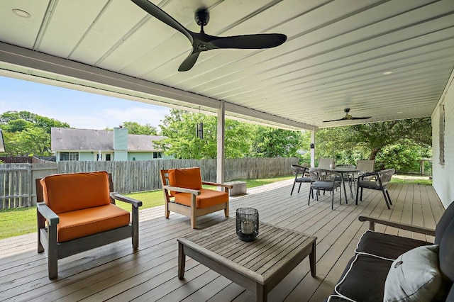 6101 Bridlington Cir, Austin, TX 78745 - wooden terrace with a ceiling fan, a fenced backyard, outdoor dining area, and an outdoor hangout area