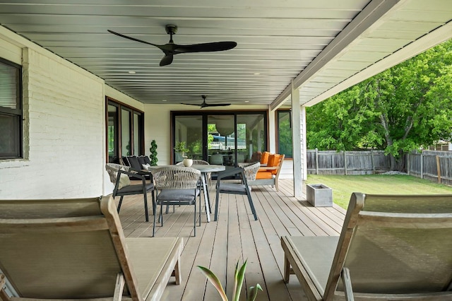 6101 Bridlington Cir, Austin, TX 78745 - wooden terrace featuring outdoor dining area, ceiling fan, and a fenced backyard