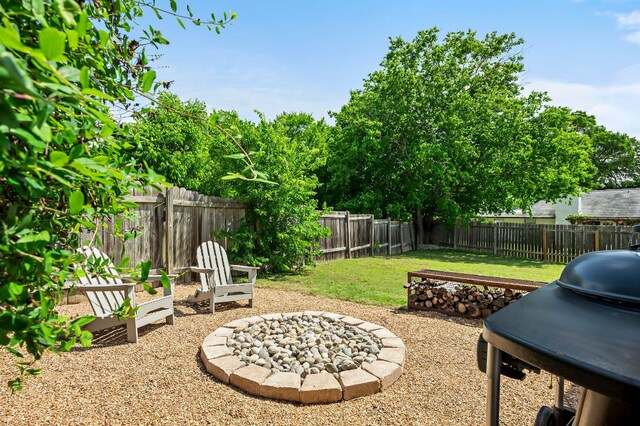 6101 Bridlington Cir, Austin, TX 78745 - fenced backyard with grilling area and a fire pit