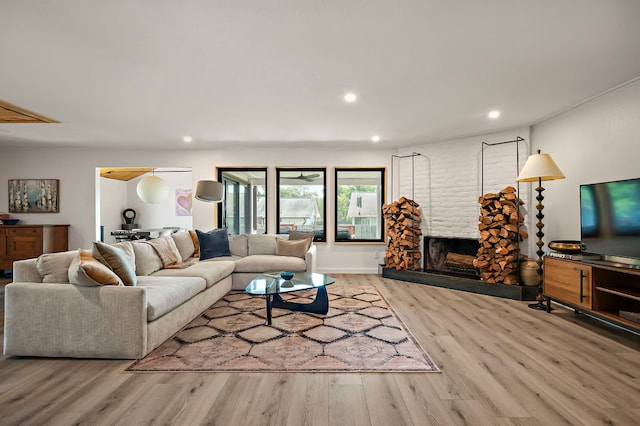 6101 Bridlington Cir, Austin, TX 78745 - living area featuring wood finished floors, a fireplace, and recessed lighting