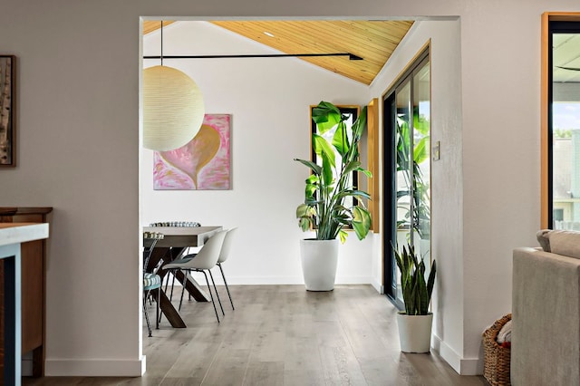 6101 Bridlington Cir, Austin, TX 78745 - dining space featuring vaulted ceiling, wooden ceiling, and wood finished floors