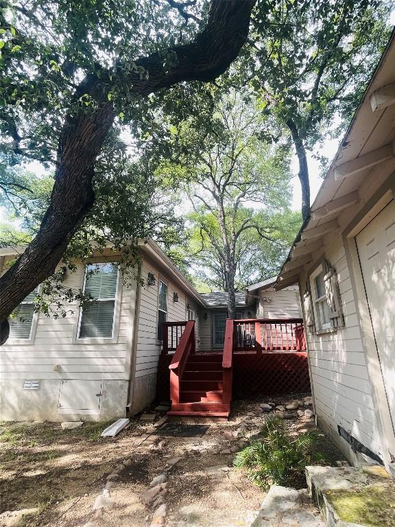 2003 Woodmont Ave, Austin, TX 78703 - view of property exterior with crawl space and a wooden deck
