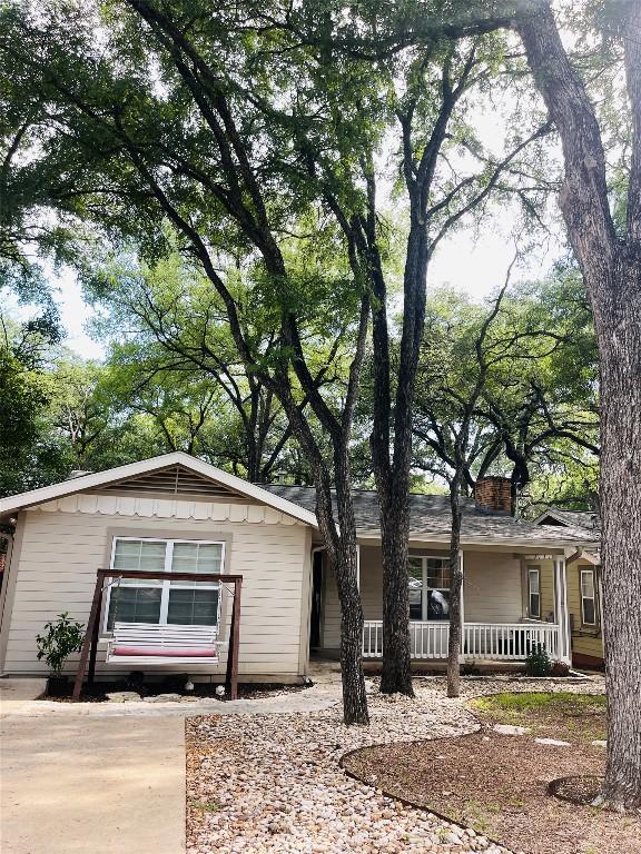 2003 Woodmont Ave, Austin, TX 78703 - single story home with a chimney and a porch