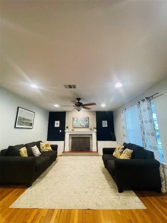 2003 Woodmont Ave, Austin, TX 78703 - living area with a fireplace, wood finished floors, recessed lighting, and a ceiling fan