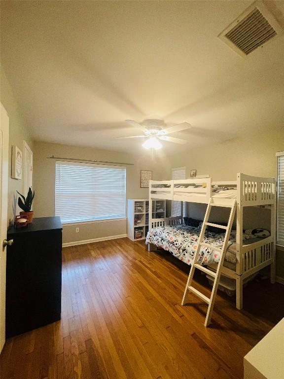 2003 Woodmont Ave, Austin, TX 78703 - bedroom with wood finished floors and a ceiling fan