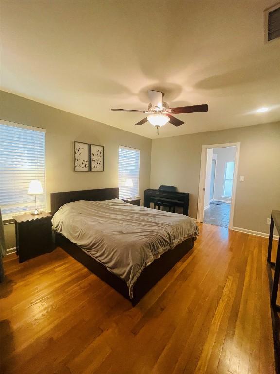 2003 Woodmont Ave, Austin, TX 78703 - bedroom with wood finished floors and a ceiling fan