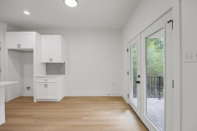 161 Honopu Dr, Bastrop, TX 78602 - unfurnished dining area with light wood finished floors and recessed lighting