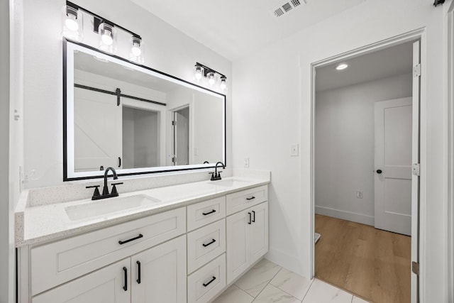 161 Honopu Dr, Bastrop, TX 78602 - bathroom with double vanity and marble look tile flooring