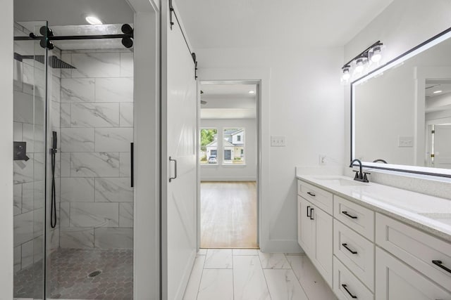 161 Honopu Dr, Bastrop, TX 78602 - bathroom with marble finish floors, double vanity, a stall shower, and recessed lighting