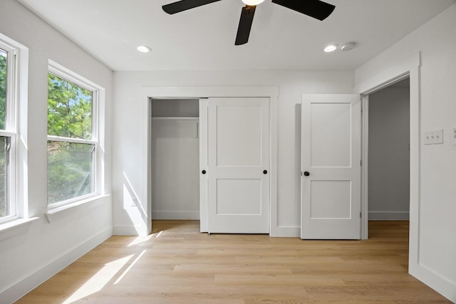 161 Honopu Dr, Bastrop, TX 78602 - unfurnished bedroom with a closet, light wood-style floors, a ceiling fan, and recessed lighting