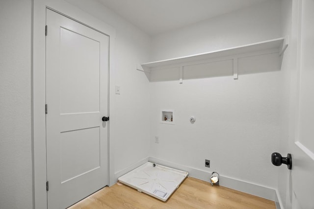 161 Honopu Dr, Bastrop, TX 78602 - washroom with light wood-style floors, gas dryer hookup, washer hookup, and hookup for an electric dryer