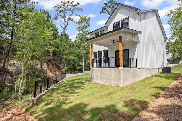 161 Honopu Dr, Bastrop, TX 78602 - back of house featuring ceiling fan and board and batten siding
