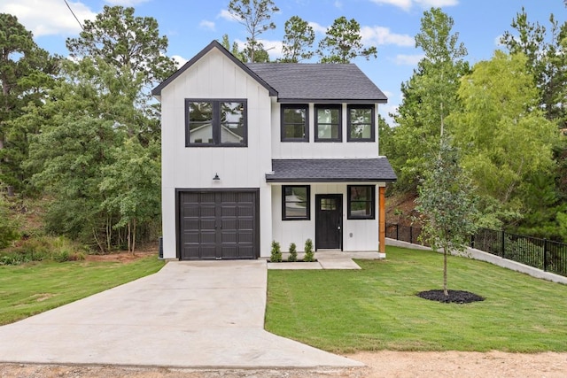 161 Honopu Dr, Bastrop, TX 78602 - view of front of home featuring a shingled roof, an attached garage, board and batten siding, and concrete driveway