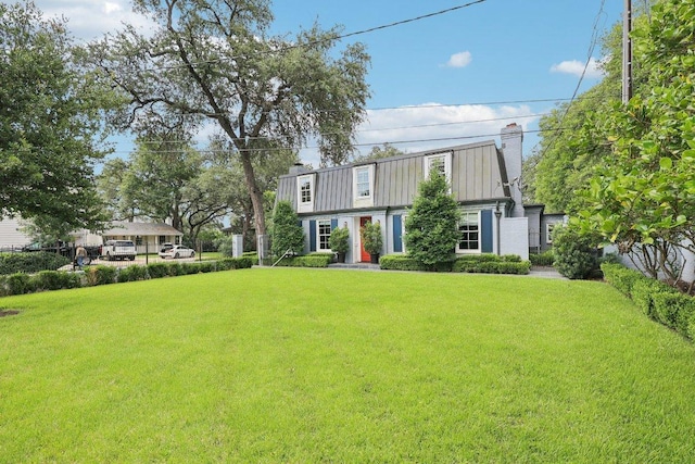 5 Green Ln, Austin, TX 78703 - colonial inspired home with a chimney and a front lawn