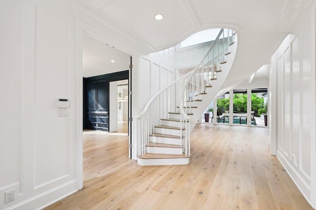 5 Green Ln, Austin, TX 78703 - stairs with a decorative wall, wood finished floors, and recessed lighting