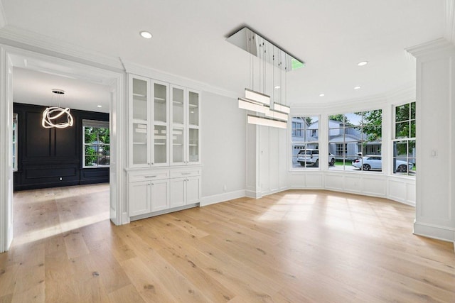 5 Green Ln, Austin, TX 78703 - unfurnished dining area with plenty of natural light, light wood-type flooring, ornamental molding, and recessed lighting