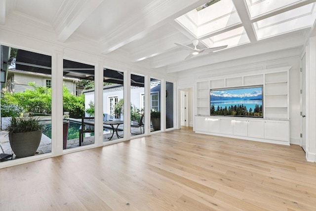 5 Green Ln, Austin, TX 78703 - unfurnished living room with a skylight, light wood-type flooring, coffered ceiling, a ceiling fan, and beamed ceiling