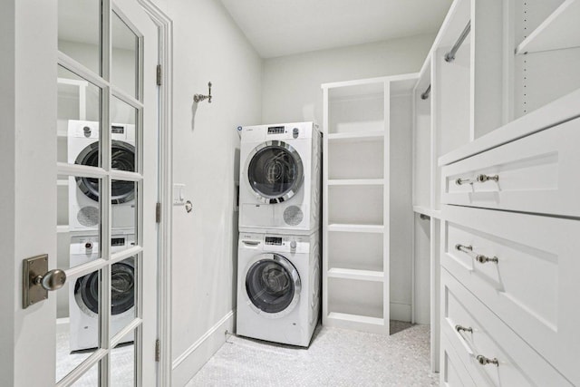 5 Green Ln, Austin, TX 78703 - laundry room with stacked washing machine and dryer and baseboards