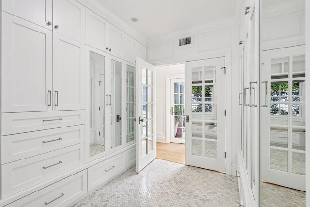 5 Green Ln, Austin, TX 78703 - walk in closet with french doors and light tile patterned flooring