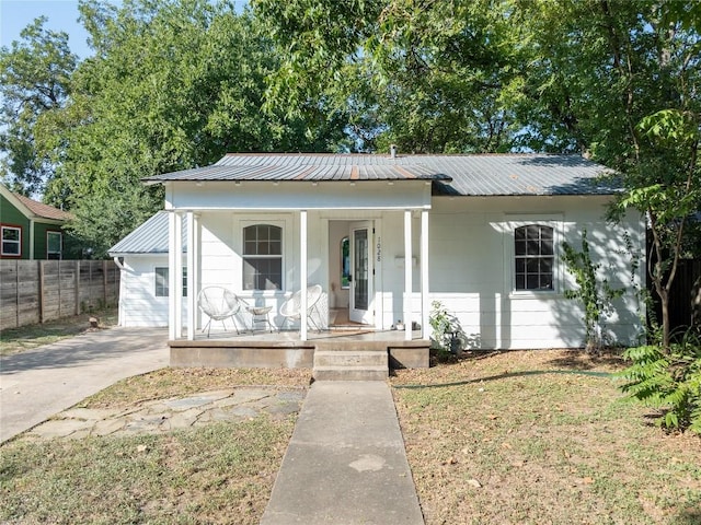 1028 E 43rd St, Austin, TX 78751 - view of front of house with a porch and a metal roof