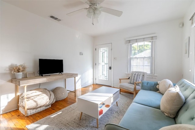 1028 E 43rd St, Austin, TX 78751 - living area with a ceiling fan and light wood-style flooring
