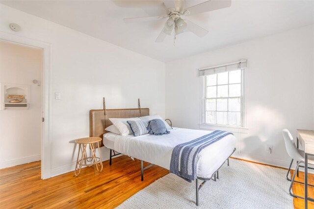 1028 E 43rd St, Austin, TX 78751 - bedroom with wood finished floors and ceiling fan