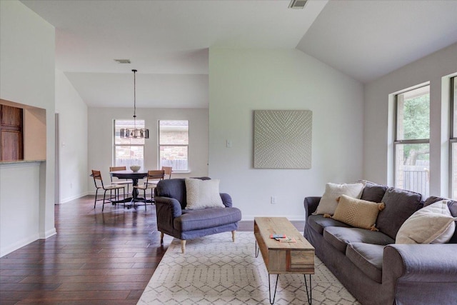11125 Cap Stone Dr, Austin, TX 78739 - living room featuring lofted ceiling, a chandelier, and hardwood / wood-style flooring