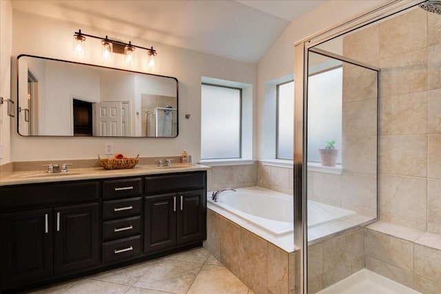 11125 Cap Stone Dr, Austin, TX 78739 - bathroom with a garden tub, double vanity, lofted ceiling, a stall shower, and tile patterned floors