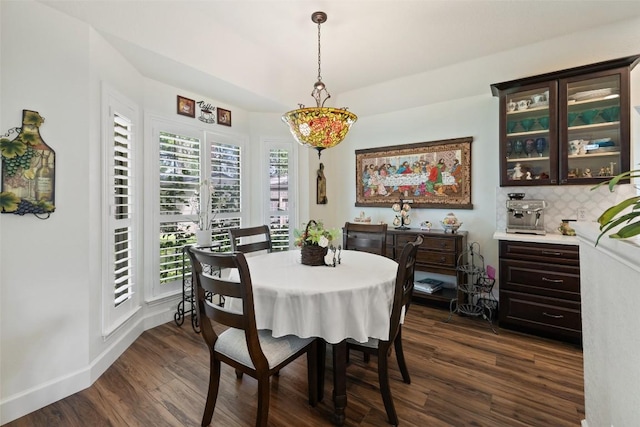 1004 Oaklands Dr, Round Rock, TX 78681 - dining area featuring dark wood finished floors and baseboards