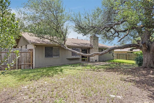 11309 Timbrook Trl, Austin, TX 78750 - rear view of property with a chimney