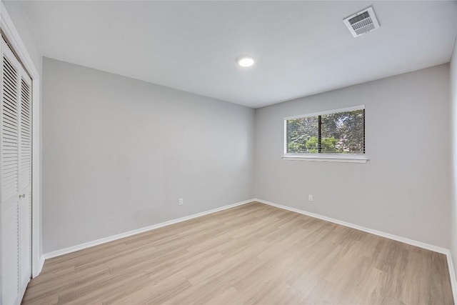 11309 Timbrook Trl, Austin, TX 78750 - unfurnished bedroom with light wood-style floors, a closet, and recessed lighting