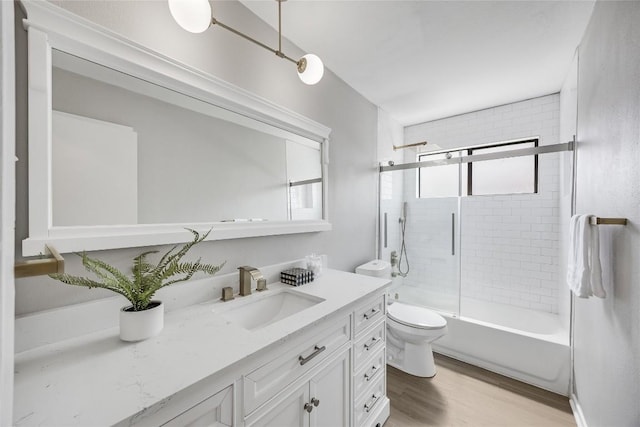 11309 Timbrook Trl, Austin, TX 78750 - bathroom featuring vanity, combined bath / shower with glass door, and wood finished floors