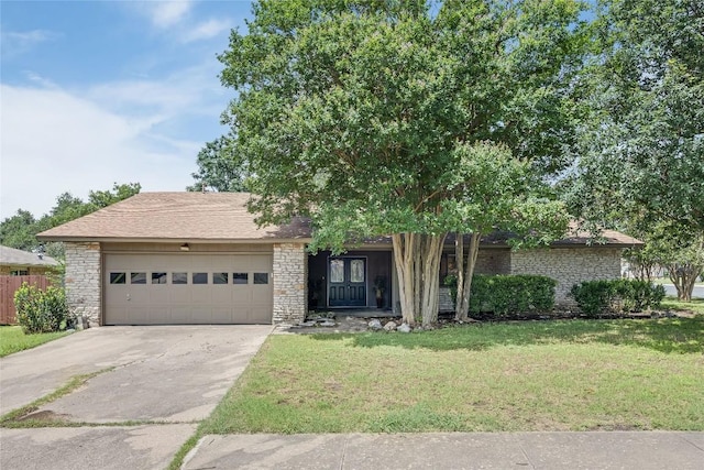 11309 Timbrook Trl, Austin, TX 78750 - view of front of property with a garage, concrete driveway, and stone siding