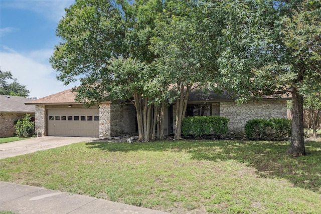 11309 Timbrook Trl, Austin, TX 78750 - view of property hidden behind natural elements featuring an attached garage, a front yard, concrete driveway, and brick siding