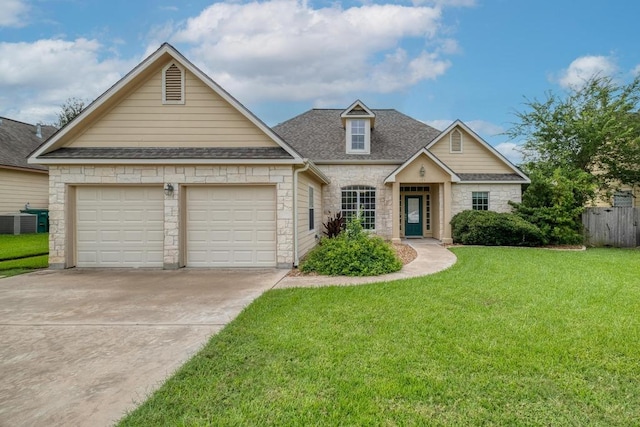 365 Rose Mayer Loop, La Grange, TX 78945 - traditional-style home with stone siding, driveway, roof with shingles, and an attached garage