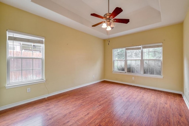 365 Rose Mayer Loop, La Grange, TX 78945 - unfurnished room featuring wood finished floors, a raised ceiling, and ceiling fan