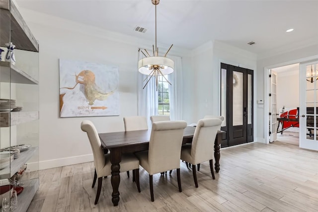 217 Emerald Ridge Dr, Austin, TX 78732 - dining room with a chandelier, light wood-type flooring, french doors, ornamental molding, and recessed lighting