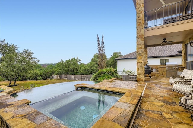 217 Emerald Ridge Dr, Austin, TX 78732 - view of pool featuring an in-ground hot tub, an outdoor kitchen, ceiling fan, and a patio