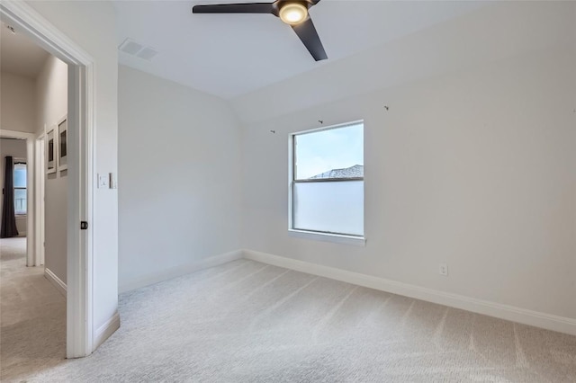 217 Emerald Ridge Dr, Austin, TX 78732 - unfurnished bedroom with light colored carpet, vaulted ceiling, and ceiling fan