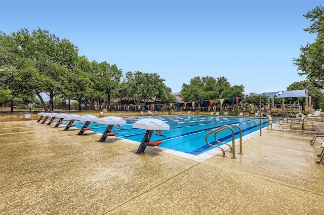 217 Emerald Ridge Dr, Austin, TX 78732 - community pool featuring a patio area