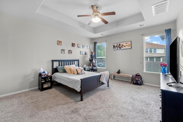 137 Paul Azinger Dr, Round Rock, TX 78664 - bedroom with a raised ceiling, carpet flooring, and ceiling fan